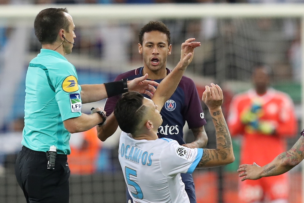 Marseille's Argentinian forward Lucas Ocampos (down) falls after an altercation with Paris Saint-Germain's Brazilian forward Neymar (up) during the French L1 football match between Marseille (OM) and Paris Saint-Germain (PSG) on October 22, 2017, at the V