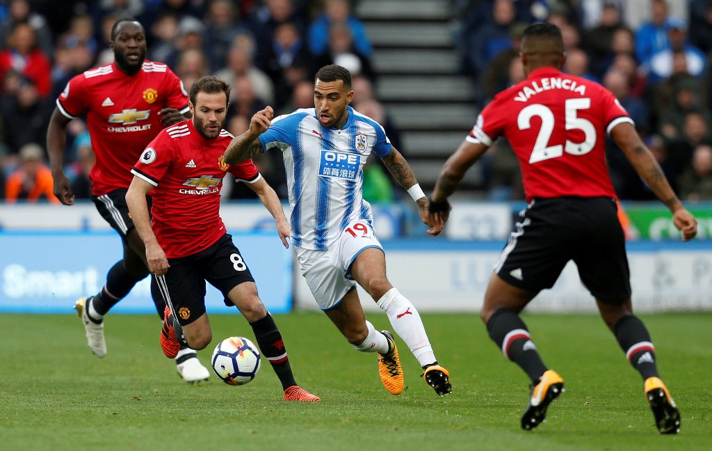 Huddersfield Town’s Danny Williams in action with Manchester United's Antonio Valencia and Juan Mata Action Images via Reuters/Ed Sykes  
