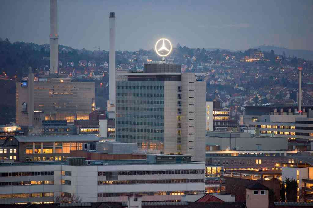 (FILES) This file photo taken on February 01, 2017 shows the Mercedes star on the headquarters of Daimler AG in Stuttgart, southwestern Germany.  AFP / THOMAS KIENZLE
