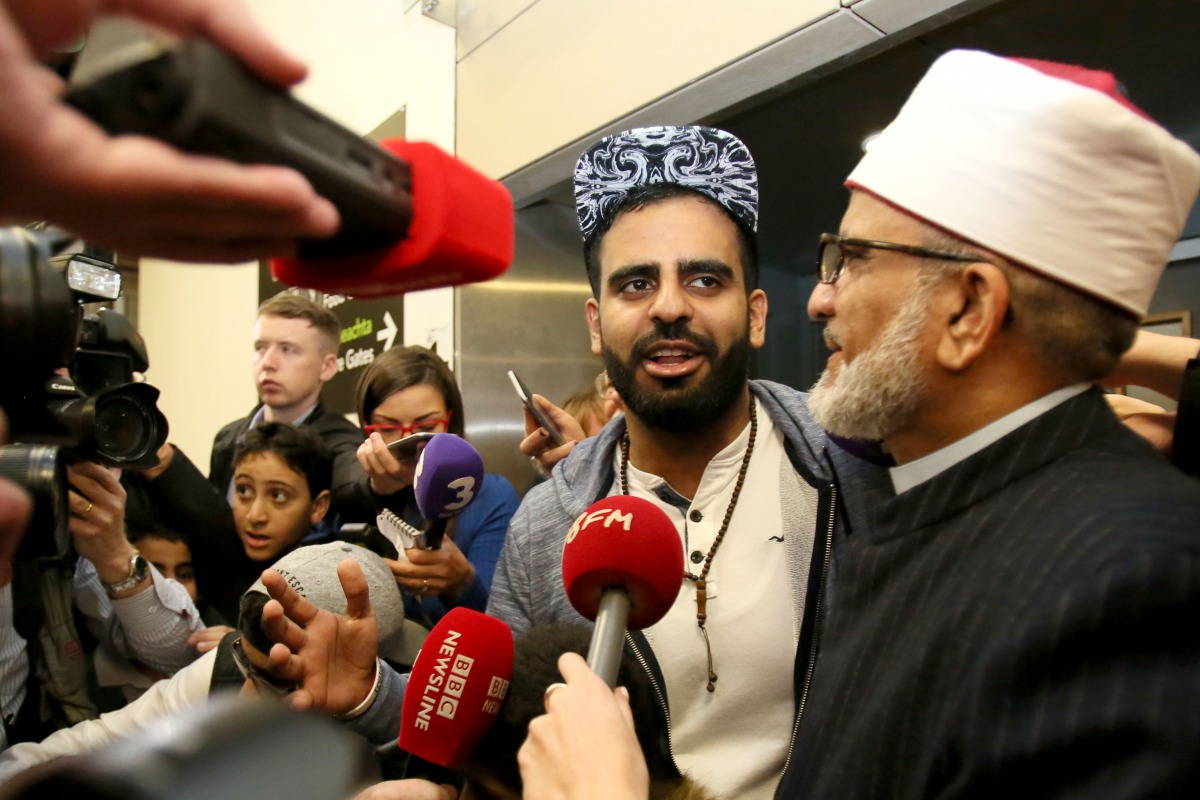 Irish citizen Ibrahim Halawa speaks to the press as he stands by his father Hussein Halawa after arriving at Dublin Airport on October 24, 2017 following his release from detention in Egypt. AFP / Paul Faith