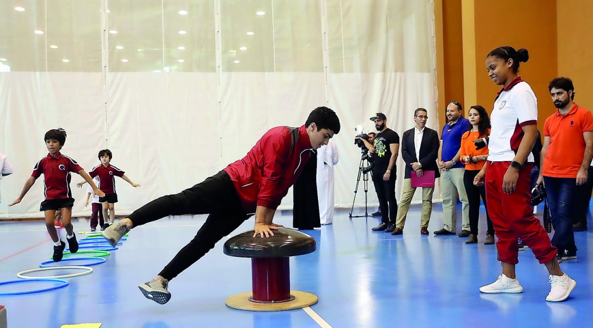 Team Qatar Gymnasts Duha and Abdulla demonstrating skills for the young students during the launched of the first stage of Kun Riyadi (‘Be an Athlete’), Qatar’s unique Athlete Development Pathway that aims to produce Qatari sporting champions.