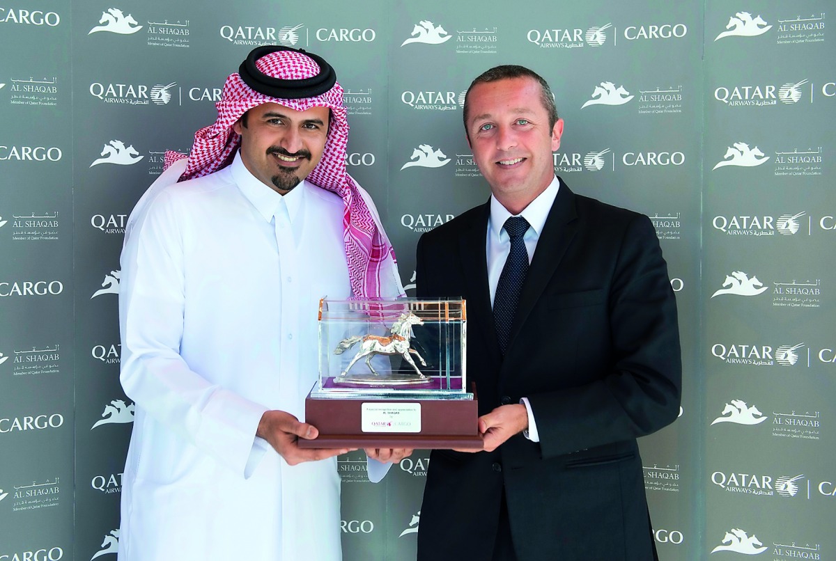 Qatar Airways Cargo presented a memento of appreciation to the Executive Director of Al Shaqab (a member of Qatar Foundation), Khalifa Al Attiya.