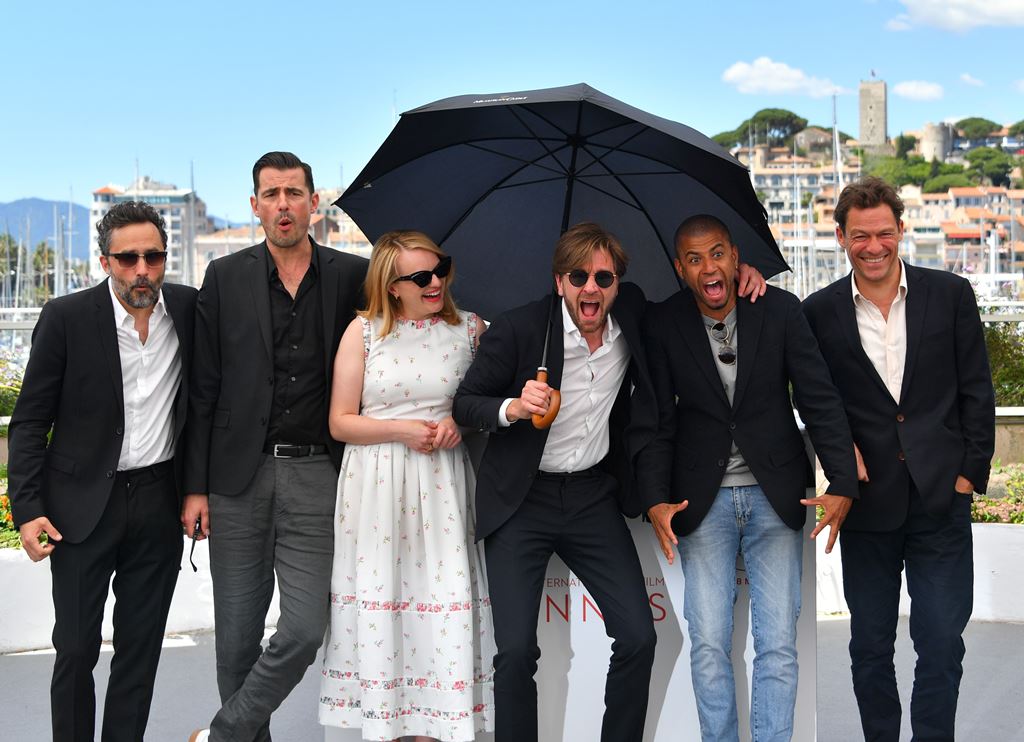 (FILES) This file photo taken on May 20, 2017 shows (from left) Swedish producer Erik Hemmendorff, Danish actor Claes Bang, US actress Elisabeth Moss, Swedish director Ruben Ostlund, Danish actor Christopher Laesso, and British actor Dominic West posing d