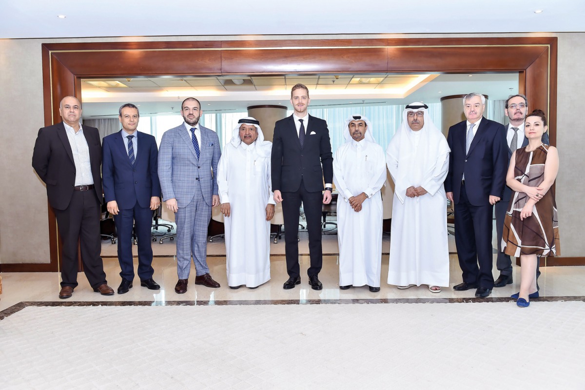 Sheikh Faisal bin Qasim Al Thani (fourth left), QBA Chairman; Ilan Laufer (fourth right), Romanian Minister for Business Environment, Commerce and Entrepreneurship; and Dr Cristian Tudor (third left) Ambassador of the Republic of Romania to Qatar along wi