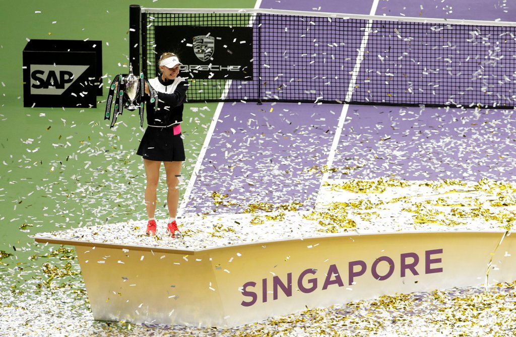 Denmark's Caroline Wozniacki celebrates with the trophy after winning the final against USA's Venus Williams REUTERS/Jeremy Lee
