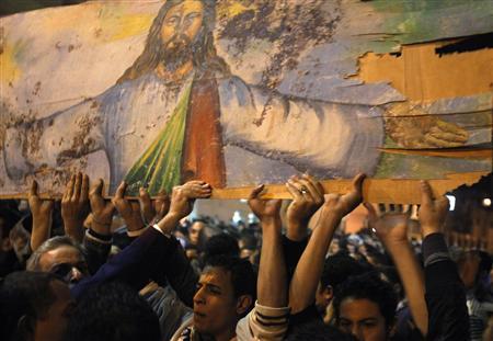 A demonstration  against the bomb attack in front of the Coptic Orthodox Church of the Two Saints in Alexandria, January 2,  2011 (Reuters / Asmaa Waguih) 