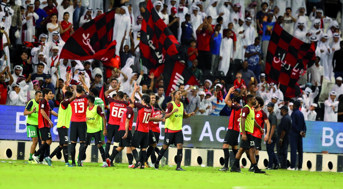 Al Rayyan players acknowledge fans after beating Al Sadd 2-1 in ‘Qatar Clasico’ at Al Sadd Stadium on Friday.   