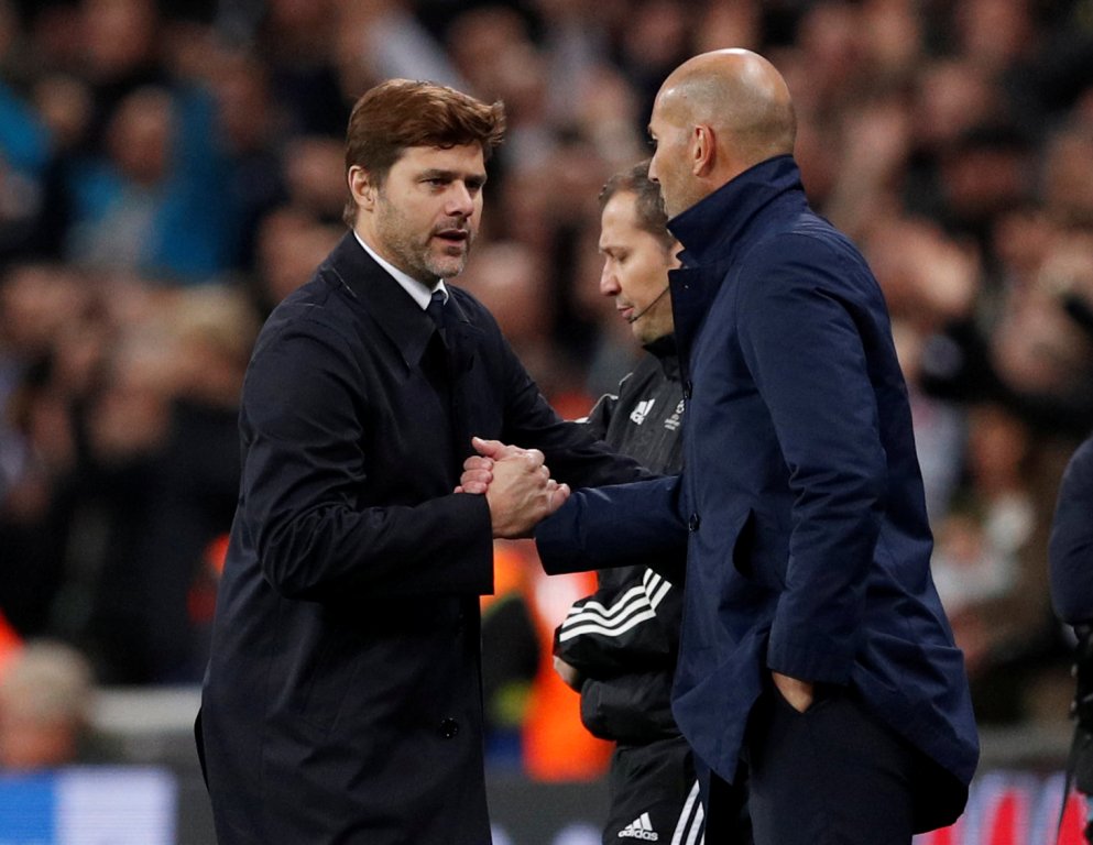 A file photo of Tottenham manager Mauricio Pochettino as he shakes hands with Real Madrid coach Zinedine Zidane after the match November 1, 2017. Action Images via Reuters/John Sibley