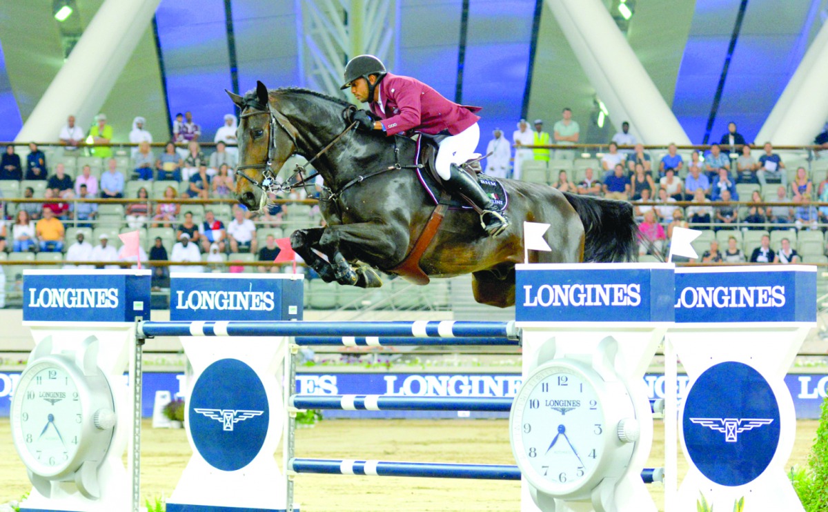Qatari rider Bassem Mohammed guides Gunder over an obstacle during the final day of the Qatar Round of Longines Global Champions Tour at Al Shaqab Arena yesterday. Pictures: Lotfi Garsi