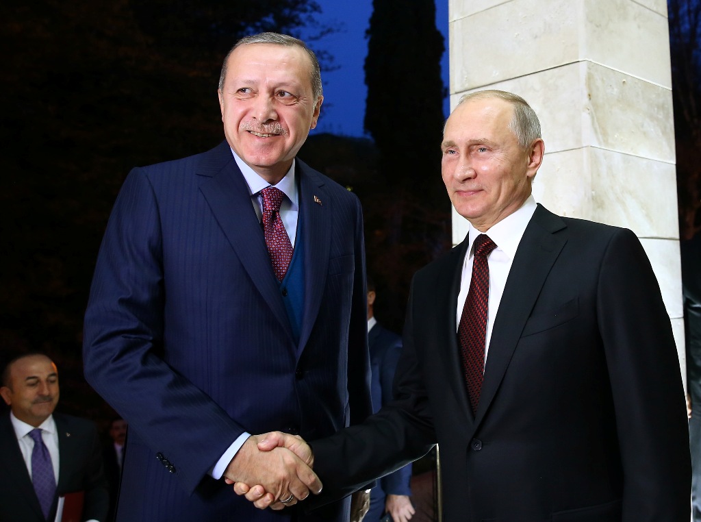 Turkish President Recep Tayyip Erdogan (L) and Russian President Vladimir Putin (R) shake hands during their meeting at the State Residence of Russian President in Sochi, Russia on November 13, 2017. ( Kayhan Özer - Anadolu Agency )