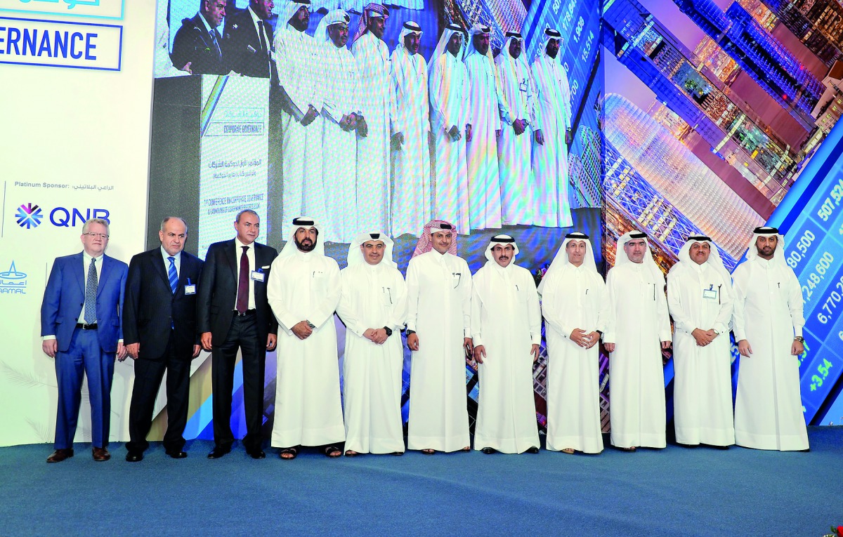 H E Sheikh Abdulla bin Saud Al Thani (fifth right), Governor at Qatar Central Bank; Sheikh Fahad bin Faisal bin Thani Al Thani (fourth right), the Deputy Governor at Qatar Central Bank;  Ali Ahmed Al Kuwari (fifth left), CEO, Qatar National Bank;  Abdul R