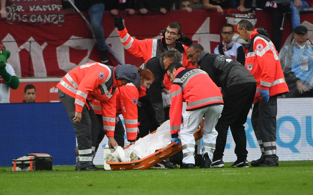 (FILES) This file photo taken on September 16, 2017 shows Stuttgart's German midfielder Christian Gentner being stretchered off during the German first division Bundesliga football match VfB Stuttgart v VfL Wolfsburg in Stuttgart, southern Germany. Stuttg