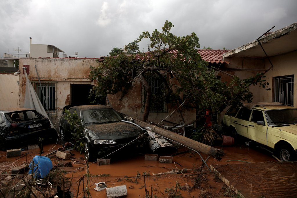 Destroyed cars are seen inside a yard following a heavy rainfall in the town of Mandra, Greece, November 15, 2017. REUTERS/Alkis Konstantinidis