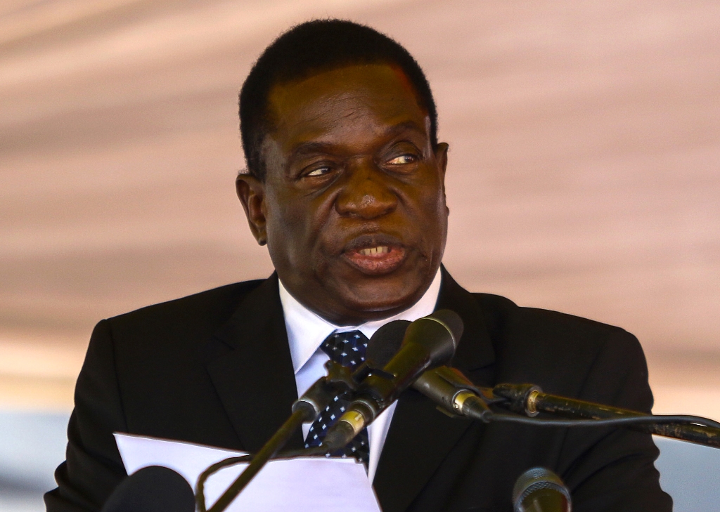 (FILES) This file photo taken on January 7, 2017 shows Zimbabwe's then acting President Emmerson Mnangagwa speaking during a funeral ceremony in Harare.  AFP / Jekesai NJIKIZANA
