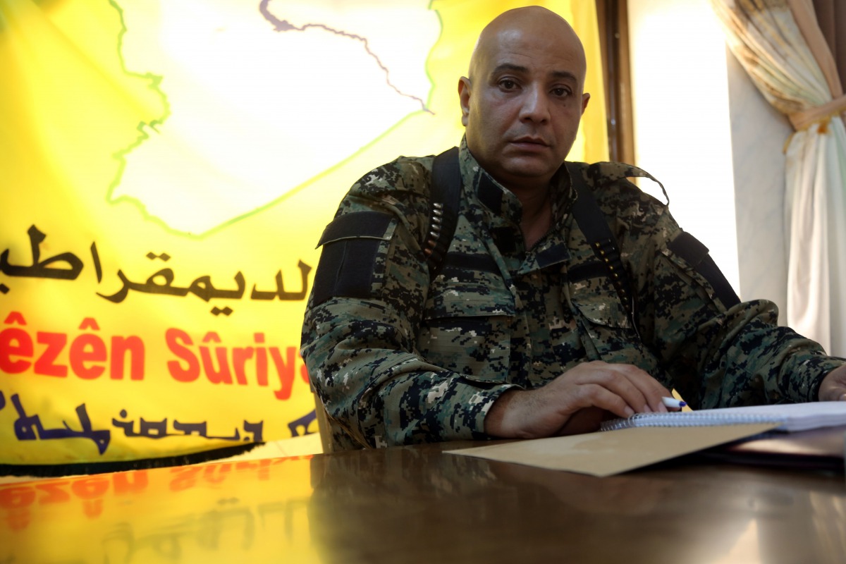 This file photo taken on November 17, 2015 shows Syrian Democratic Forces (SDF) spokesman Talal Ali Sello posing for a photo during an interview with AFP in the coalition's headquarters in the northeastern Syrian city of Hasakeh. AFP / Delil Souleiman