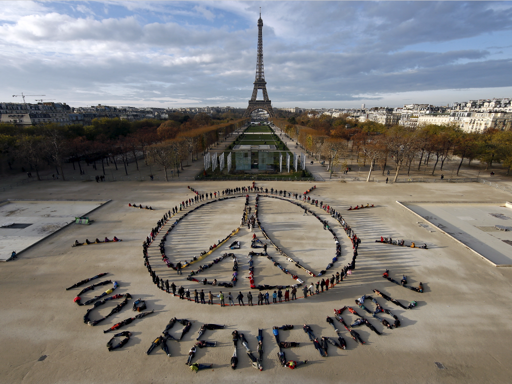 A Reuters file photo of environmentalists forming a message of hope and peace in front of the Eiffel Tower in Paris, France.