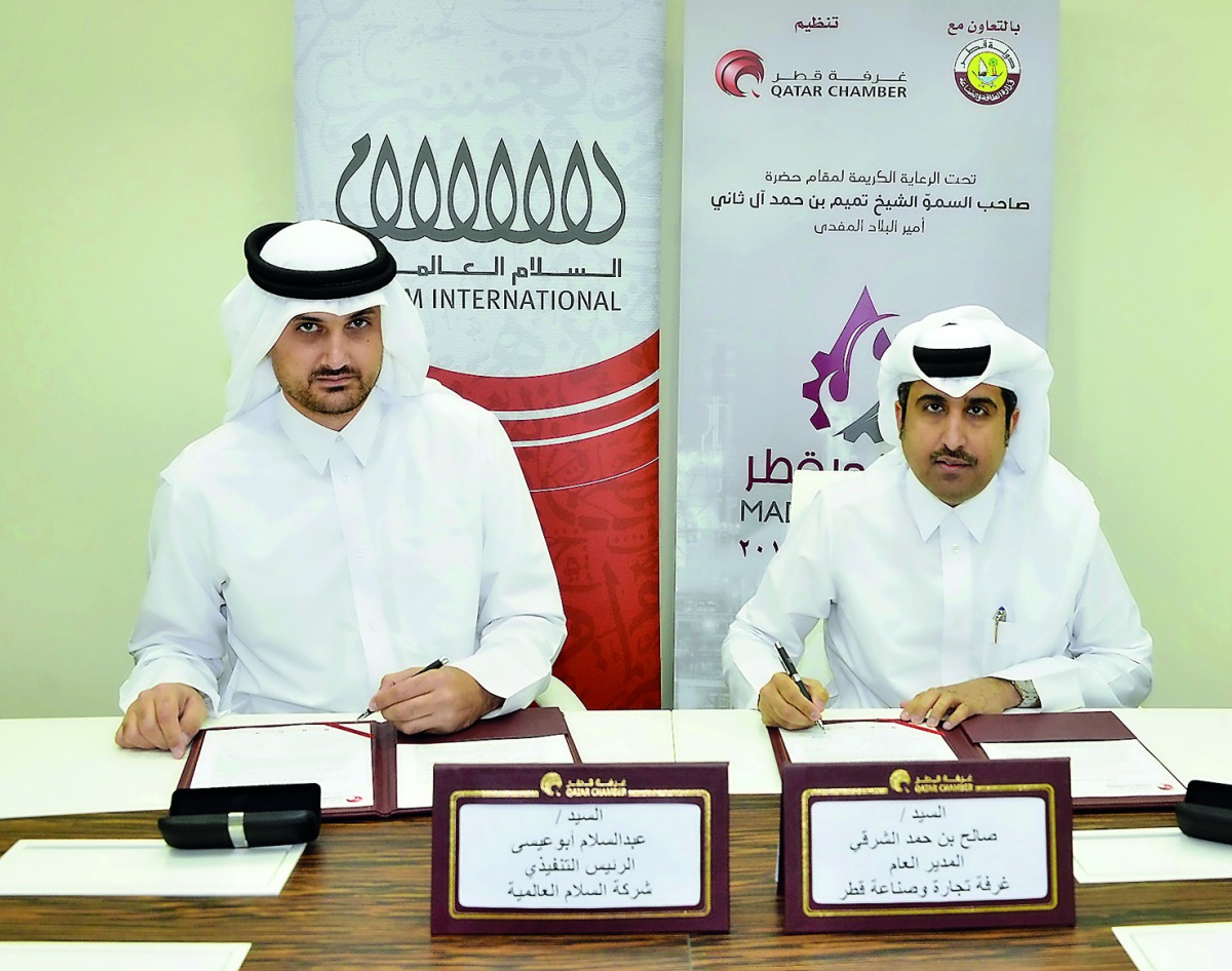 Saleh bin Hamad Al Sharqi (right), Qatar Chamber Director-General; and Abdul Salam Abu Issa, Salam International’s CEO, signing the sponsorship deal, yesterday at Qatar Chamber headquarters.
