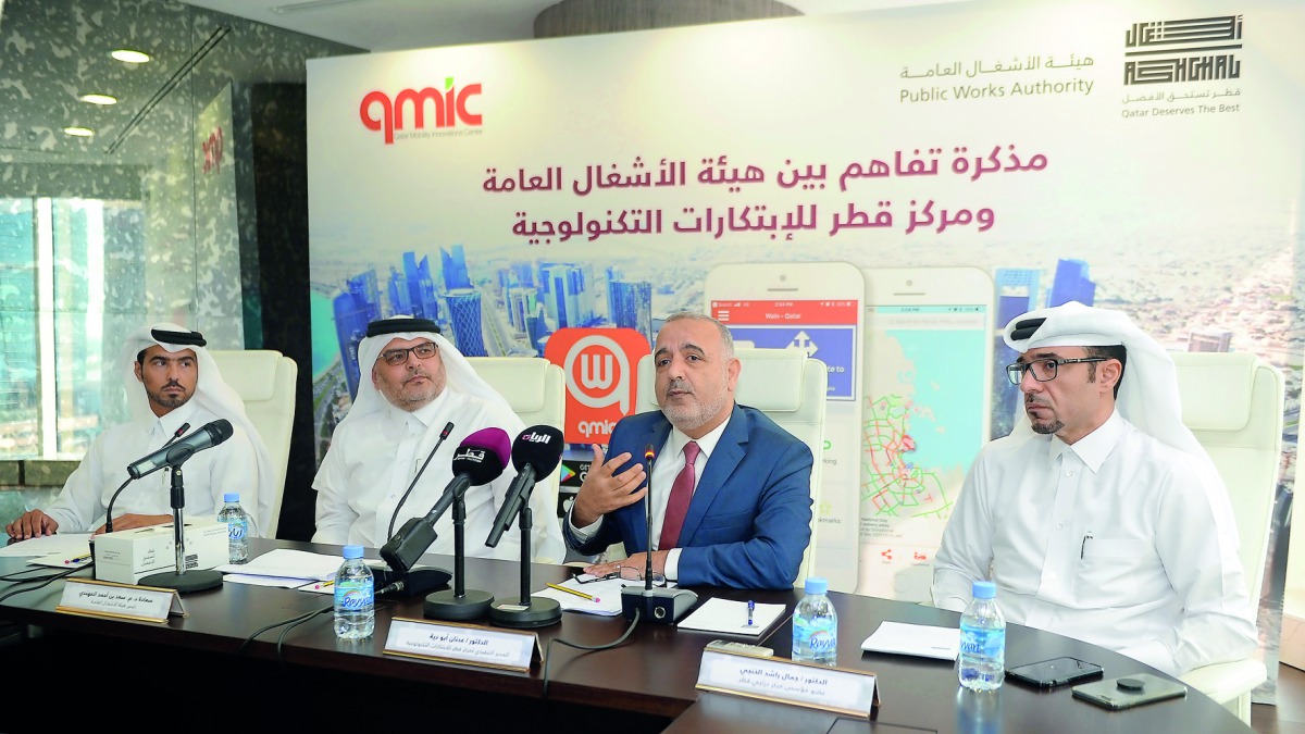 Ashghal President Dr. Eng. Saad bin Ahmad Al Muhannadi (second left) and QMIC Executive Director Dr. Adnan Abu Dayya (second right) along with other officials at the signing ceremony yesterday. Pic: Abdul Basit / The Peninsula