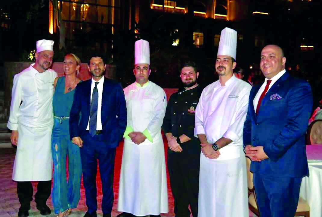 Italian Ambassador, Pasquale Salzano (third left), Chef Massimo Malantrucco (left), and Italian Chamber of Commerce in Qatar Founder and Chairperson, Palma Libotte (second left),  along with chefs and officials from Marsa Malaz Kempinski and Antica Pesa R
