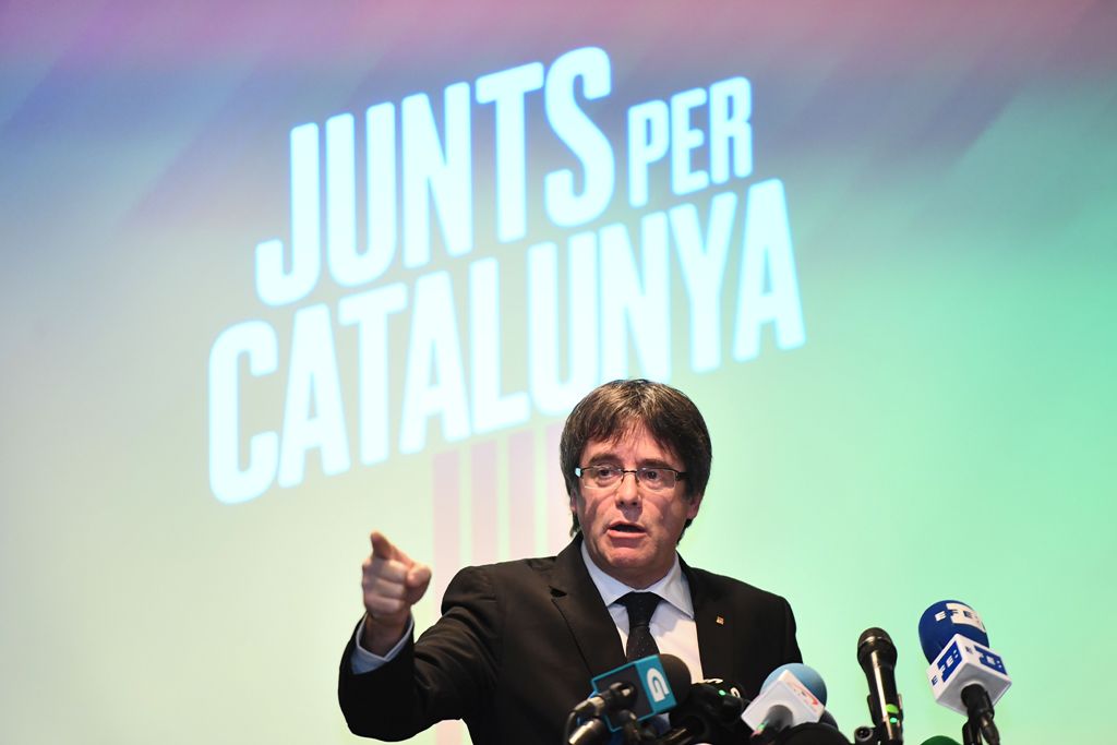 Deposed Catalan leader Carles Puigdemont gives a press conference in Oostkamp, near Brugge, on November 25, 2017, to announce his candidacy for Catalan regional elections and unveil his electoral list for the December 21 election. The slogan reads 