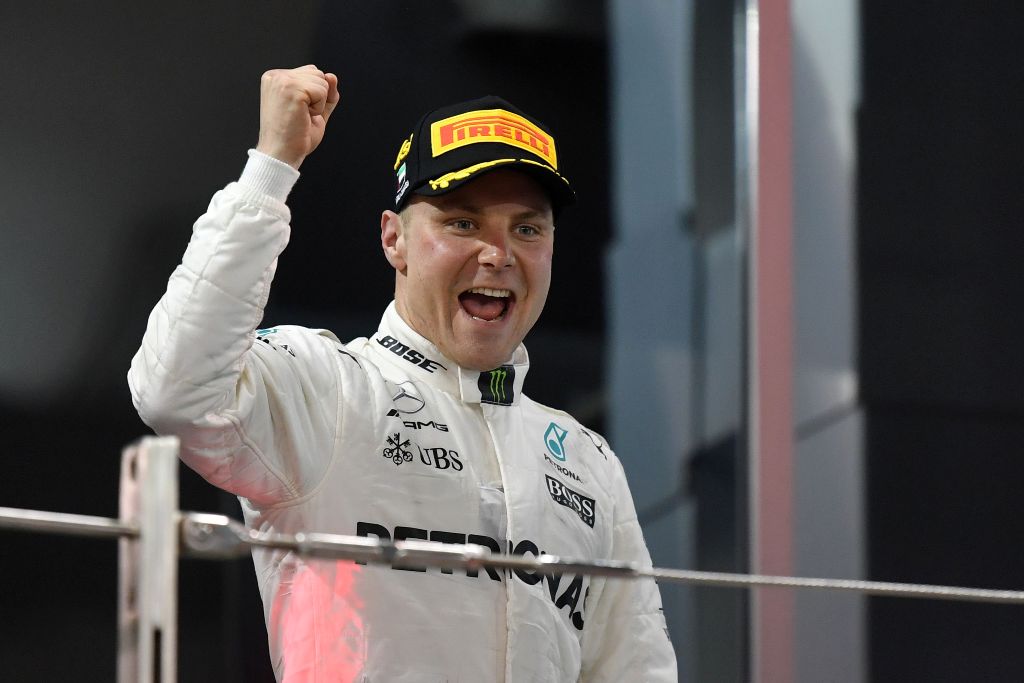 Mercedes' Finnish driver Valtteri Bottas celebrates at the end of the Abu Dhabi Formula One Grand Prix at the Yas Marina circuit on November 26, 2017. / AFP / Andrej ISAKOVIC