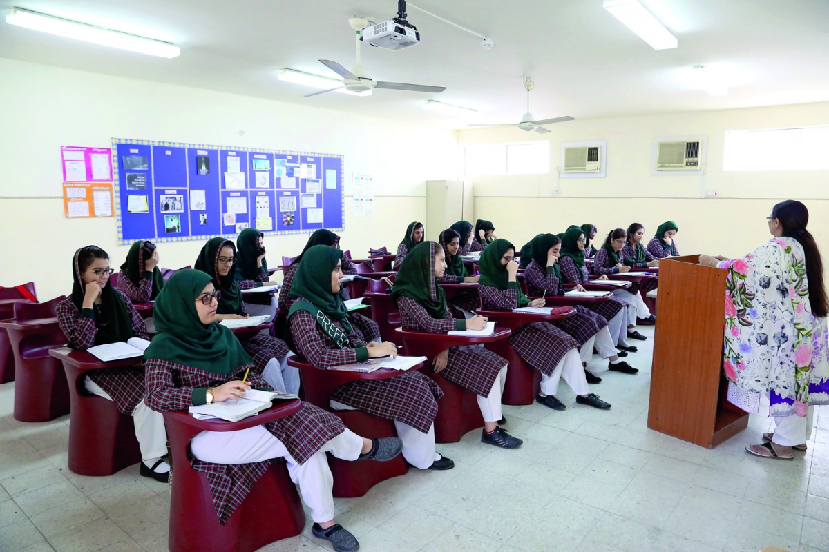 Students sit on new chairs provided by Jassim and Hamad bin Jassim Charitable Foundation at PIS classroom. 