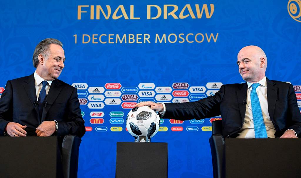 FIFA president Gianni Infantino (R) and Russian deputy prime minister Vitaly Mutko give a press conference prior to the Final Draw for the 2018 FIFA World Cup football tournament in Moscow on December 01, 2017. / AFP / Alexander NEMENOV
