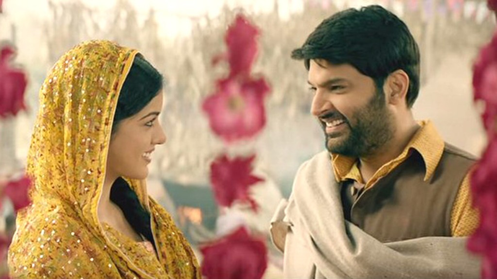 A still of the actors Kapil Sharma and Ishita Dutta from the movie Firangi.