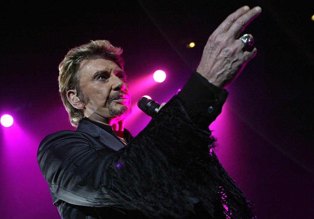 (FILES) This file photo taken on December 6, 2003 shows French singer Johnny Hallyday performing on stage in Clermont-Ferrand. AFP / THIERRY ZOCCOLAN