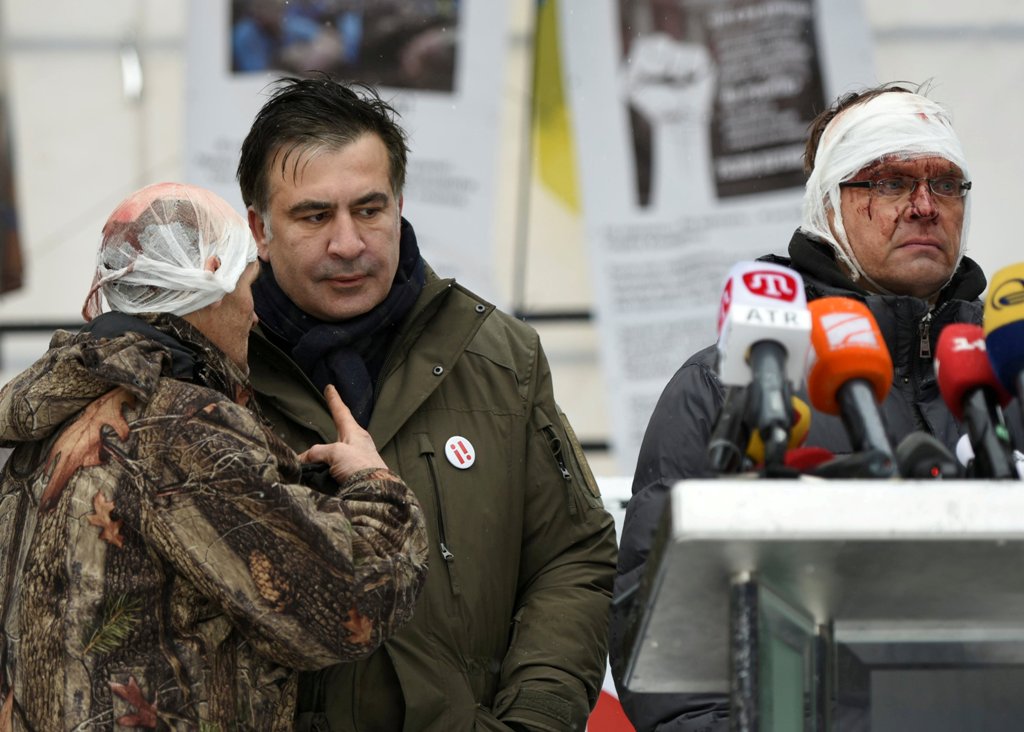 Former Georgian President Mikheil Saakashvili talks to his supporters, who say they were injured in clashes with the police, in front of the Parliament building in Kiev, Ukraine December 6, 2017. REUTERS/Oleh Tereshchenko
