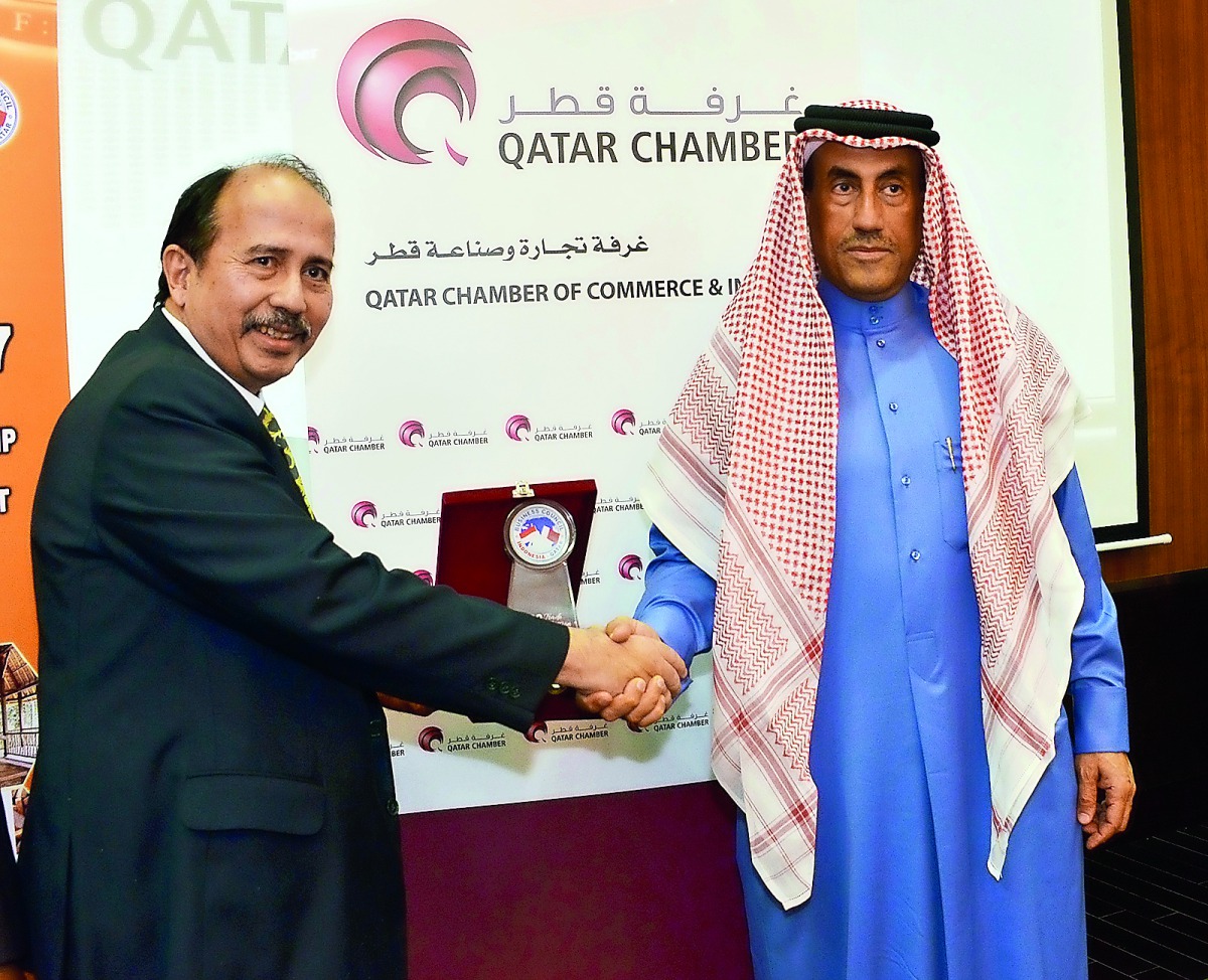 Ali bin Abdulatif Al Misnad (right), Board Member and Honorary Treasurer of QC; shake hands with Helmy Shebubakar, Vice-Chairman of Indonesian Chamber of Commerce,  during the Qatari-Indonesian Business Forum, at Qatar Chamber head quarters, yesterday.