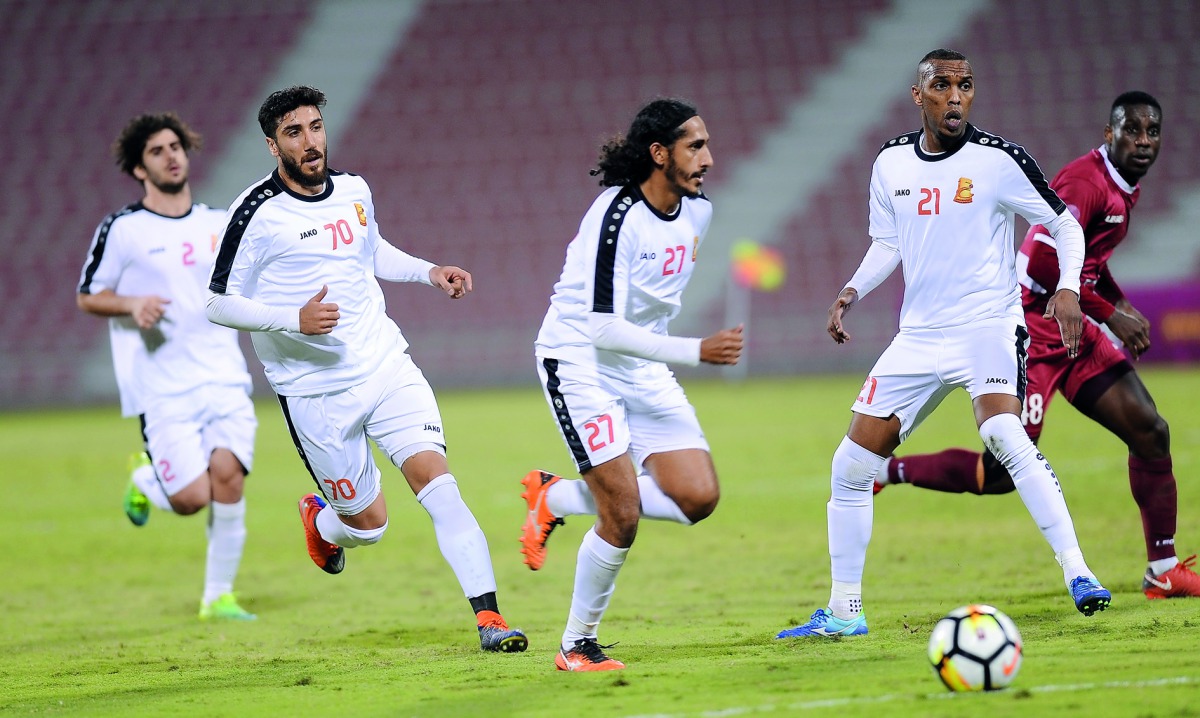 Umm Salal players in action during their QSL Cup match against Al Markhiya  at Al Arabi Stadium.