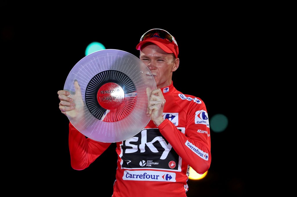 FILE PHOTO: Team Sky rider Chris Froome of Britain celebrates on the podium after winning the Vuelta Tour of Spain after the last stage of the cycling race between Arroyomolinos and Madrid, September 10, 2017. REUTERS/Susana Vera/File Photo
