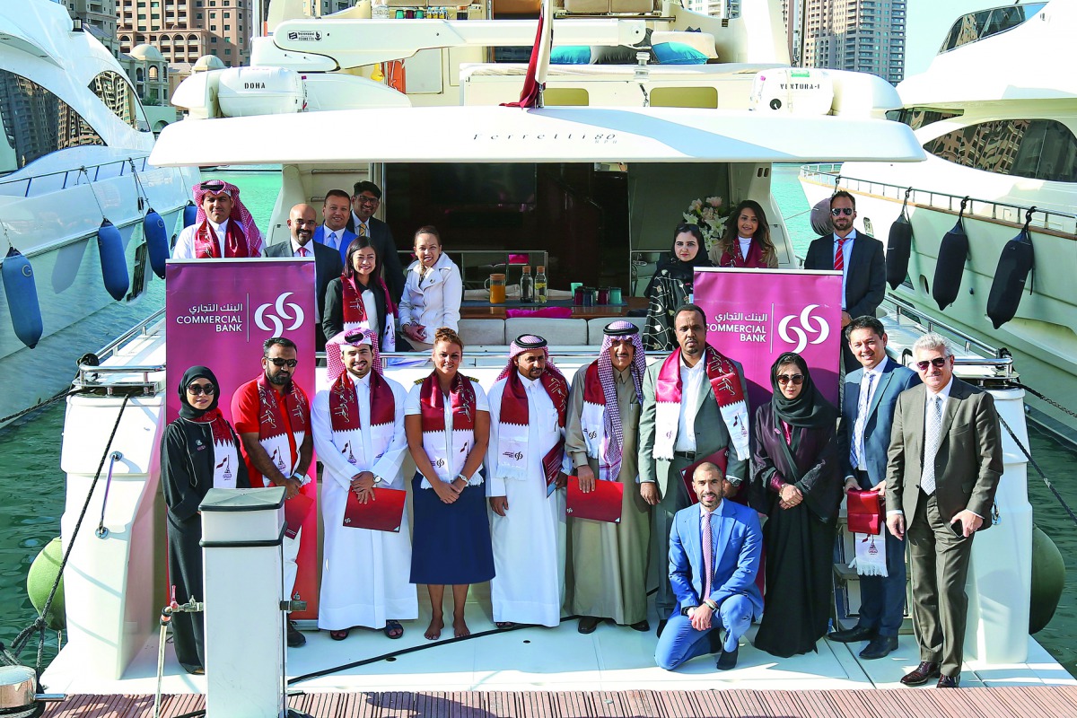 Commerical bank officials with some of the lucky customers who won the unique and private luxury yacht experience.