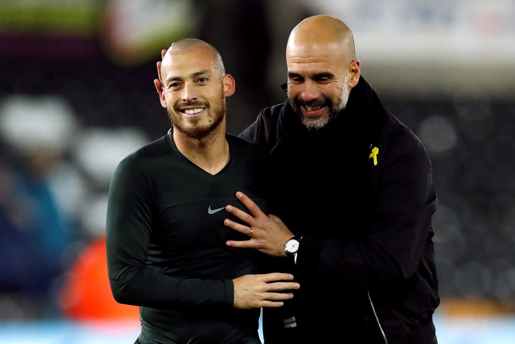 Manchester City manager Pep Guardiola celebrates with David Silva at the end of the match Action Images via Reuters/Andrew Boyers  

