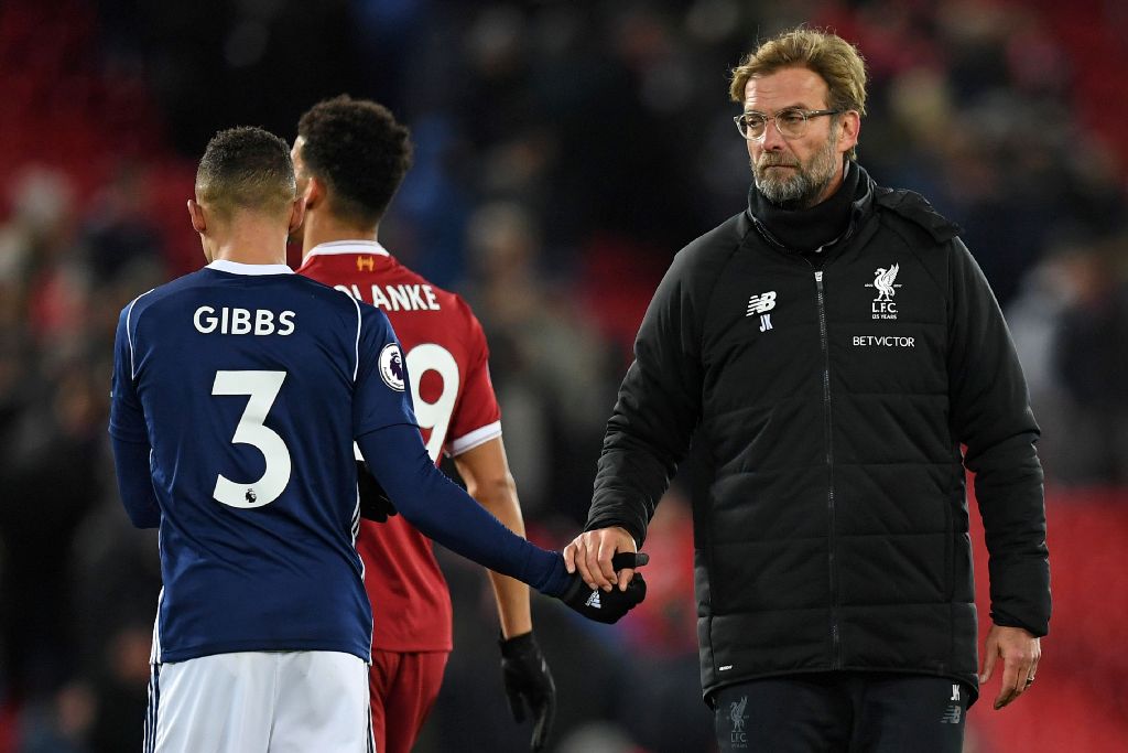 Liverpool's German manager Jurgen Klopp (R) shakes hands with West Bromwich Albion's English defender Kieran Gibbs (L) on the pitch after the English Premier League football match between Liverpool and West Bromwich Albion at Anfield in Liverpool, north w