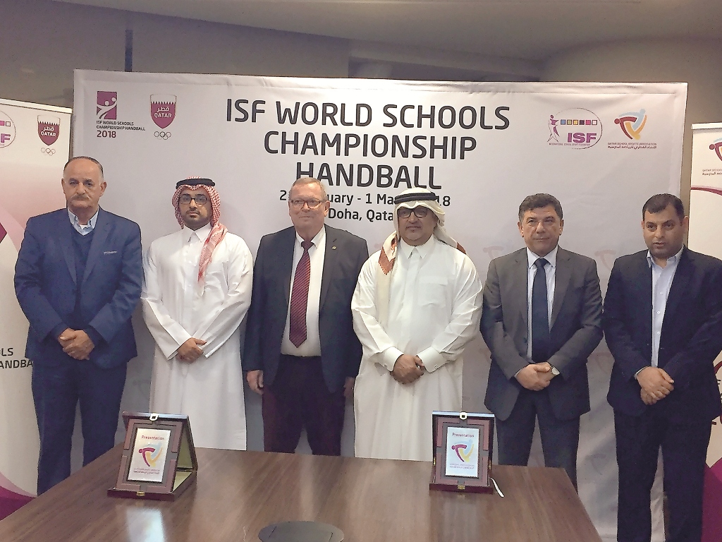 Qatar School Sports Association Secretary General Ali Ahmed Al Hitmi and International School Sports Federation Deputy President Stelios Daskalakis along with other officials pose for a group photo following a draw ceremony for the 24th ISF World Schools 