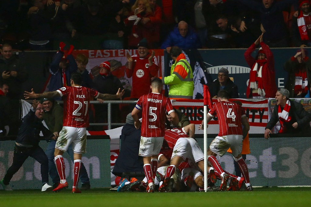 Bristol City's English midfielder Korey Smith celebrates with teammates scoring the second goal during the English League Cup quarter-final football match between Bristol City and Manchester United at Ashton Gate Stadium in Bristol, southwest England on D