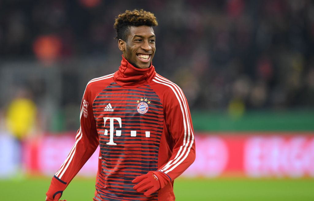 Bayern Munich's French defender Kingsley Coman smiles before the German football Cup DFB Pokal round of sixteen football match during the Bayern Munich vs Dortmund on December 20, 2017 in Munich.  AFP / Christof STACHE