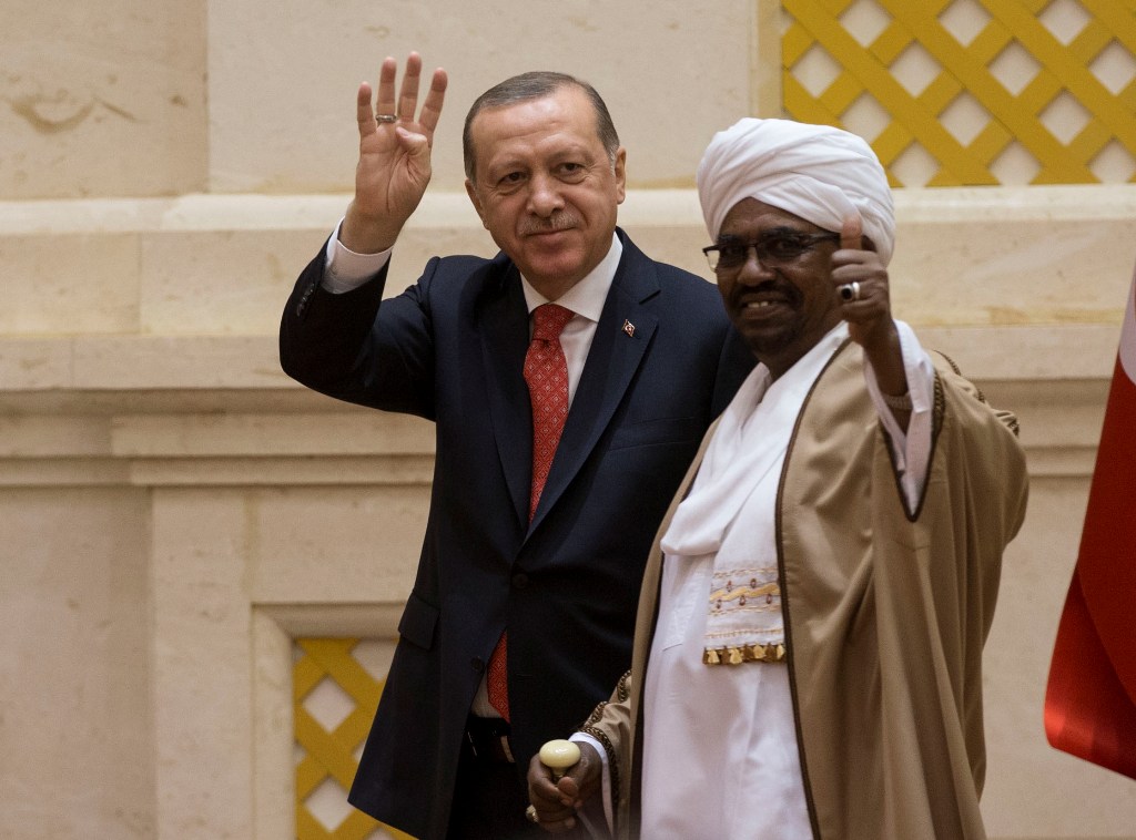 President of Turkey Recep Tayyip Erdogan (L) and President of Sudan Omar Al-Bashir (R) gesture during a joint press conference following their inter-delegation meeting in Khartoum, Sudan on December 24, 2017. Binnur Ege Gürün - Anadolu