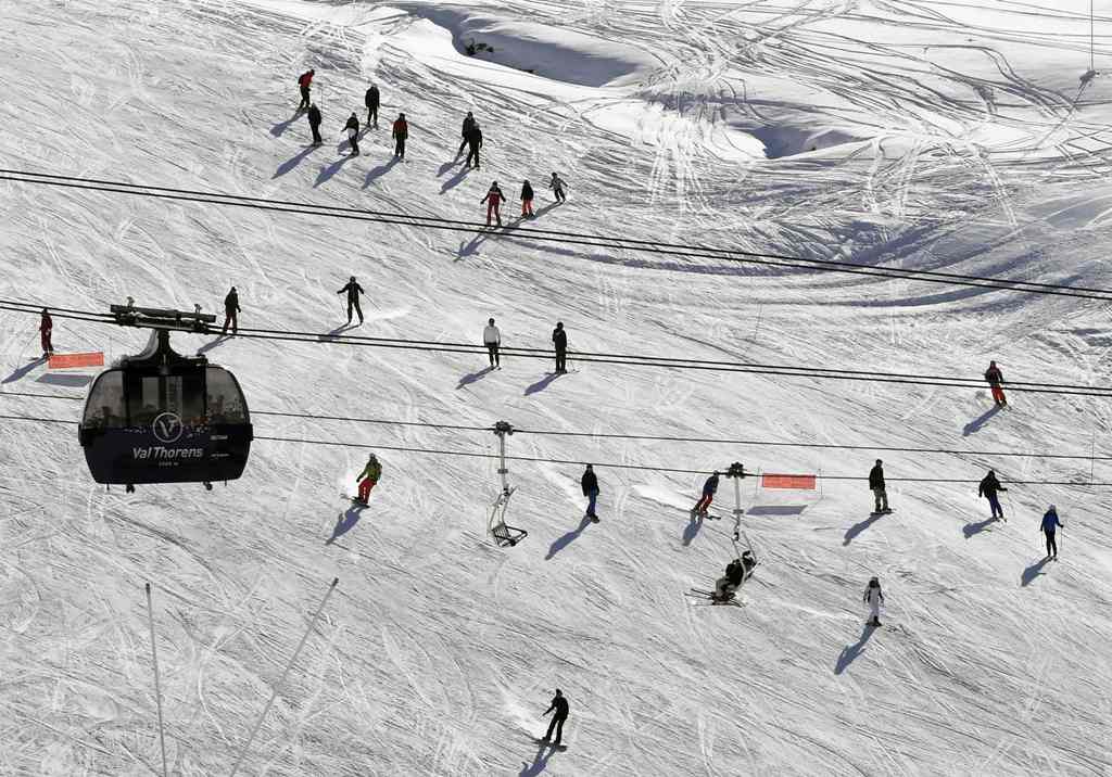 This file photo taken on November 26, 2016 shows people skiing down a slope on the opening weekend of the ski season at Val Thorens ski resort, in the French Alps. / AFP.
