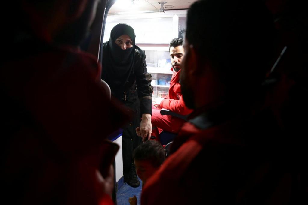 A woman and girl are seen in an ambulance during medical evacuation from the besieged town of Douma, eastern Ghouta to Damascus, Syria December 27, 2017. REUTERS/Bassam Khabieh.