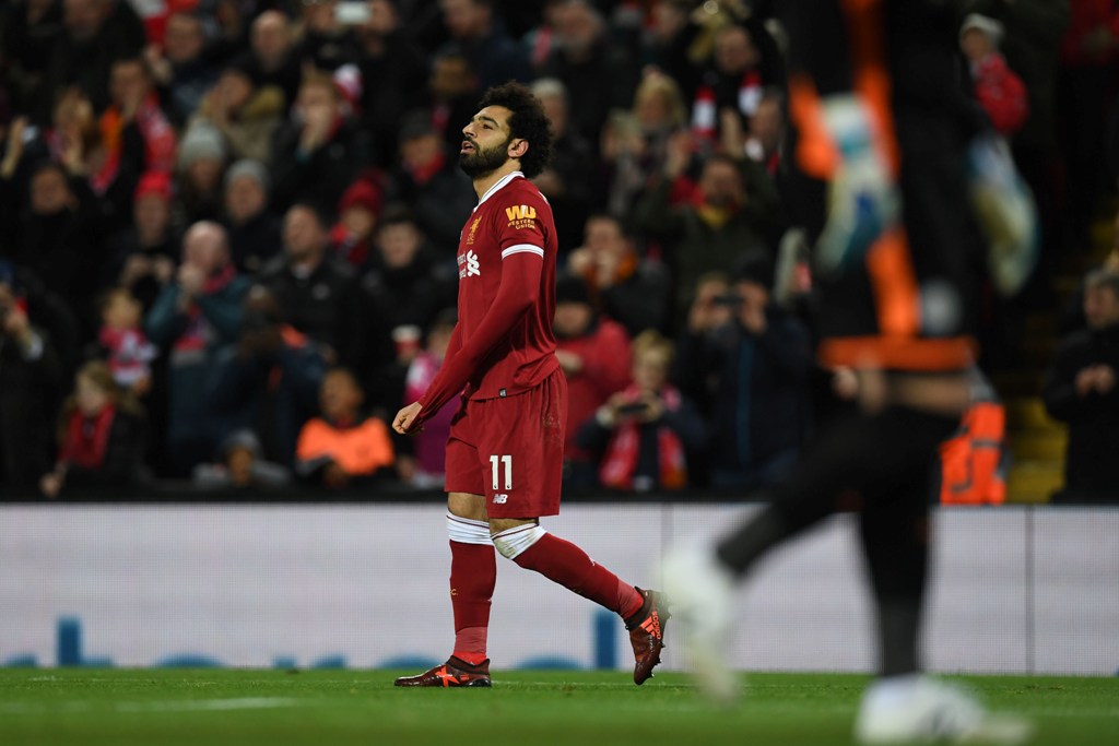Liverpool's Egyptian midfielder Mohamed Salah celebrates scoring the team's second goal during the English Premier League football match between Liverpool and Leicester at Anfield in Liverpool, north west England on December 30, 2017.  AFP / Paul ELLIS 
