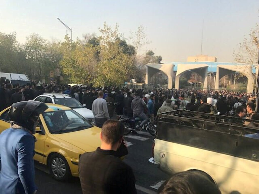 People protest near the university of Tehran, Iran December 30, 2017 in this picture obtained from social media. REUTERS. 