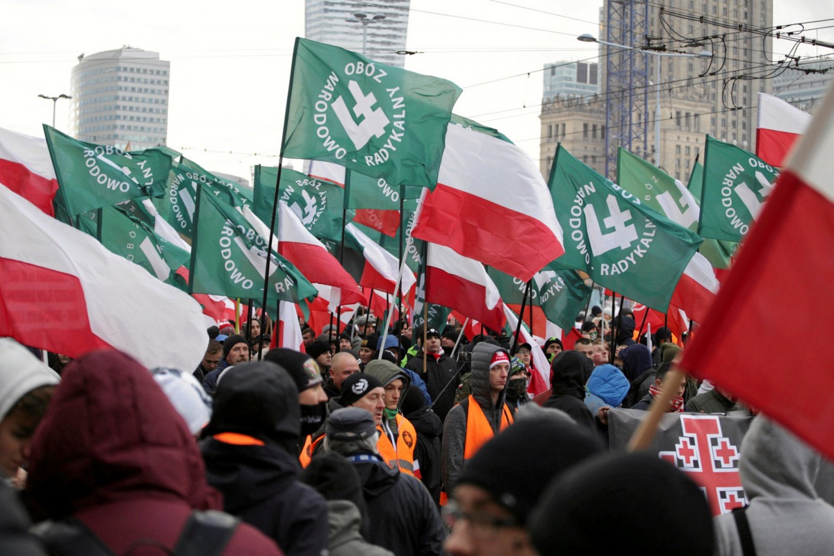 Protesters carry Polish flags and National Radical Camp (ONR) flags during a rally, organised by far-right, nationalist groups, to mark 99th anniversary of Polish independence in Warsaw, Poland November 11, 2017. Agencja Gazeta/Adam Stepien/File photo via