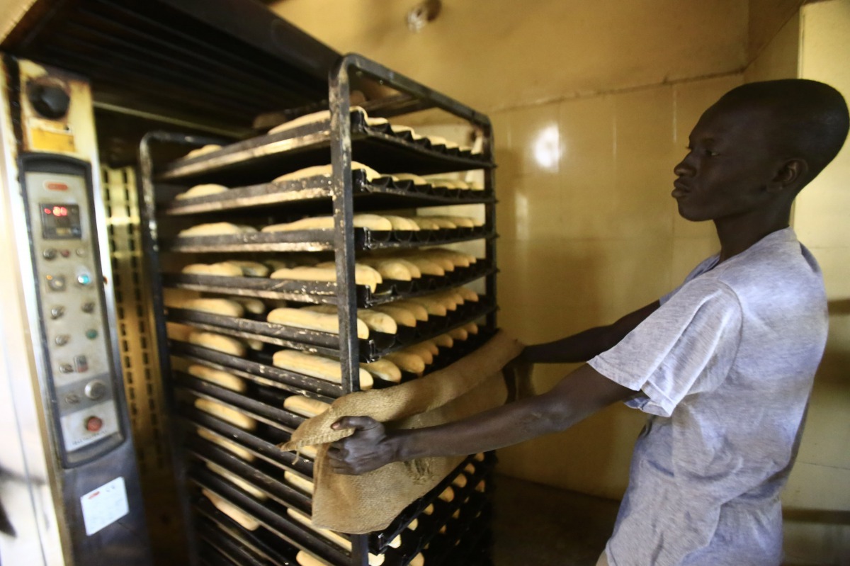 A Sudanese man works at a bakery in the capital Khartoum on January 5, 2018. AFP / Ashraf Shazly
