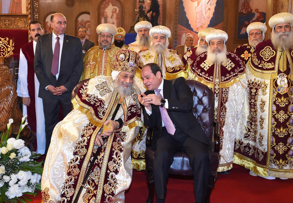 Egyptian Coptic Pope Tawadros II (L), Pope of the Coptic Orthodox Church of Alexandria and Patriarch of Saint Marc Episcopate receives Egyptian President Abdel Fattah al-Sisi (R), at the new Coptic Cathedral at the new Coptic Cathedral 