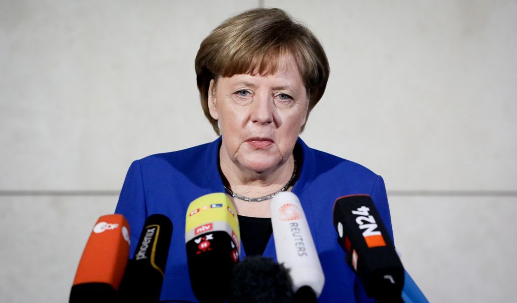German Chancellor and Christian Democratic Union (CDU) leader Angela Merkel gives a statement as she arrives for talks with the leaders of the conservative CDU/CSU union and the social democratic SPD party on forming a new government on January 11, 2018 a