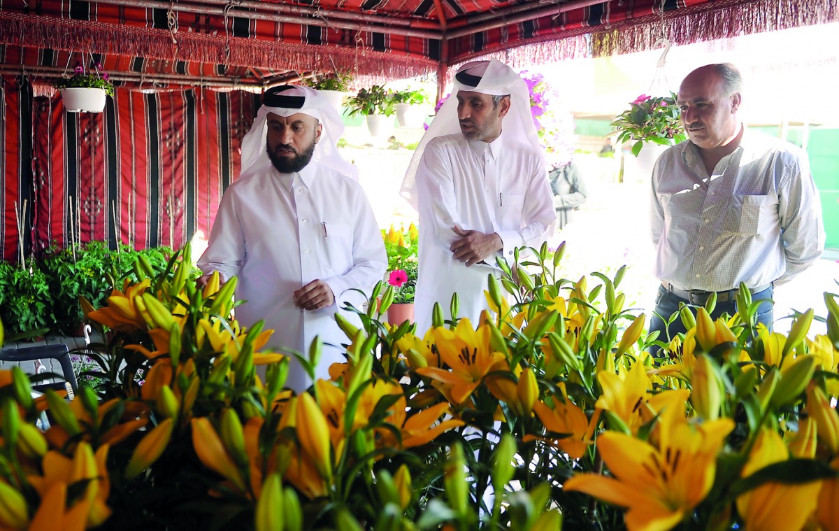 Youssef Khalid Al Khulaifi, Agricultural Affairs Department Director (left), and Abdul Rehman Al Sulaiti (centre), General Supervisor of Agricultural Product Yards with other officials on the Opening of flower festival at Al- Mazrouah yard near Umm Salal 
