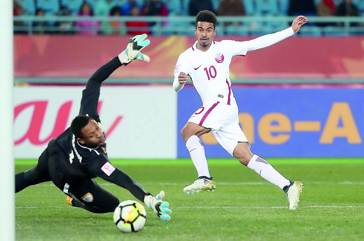 Qatar’s Akram Afif (right) scores the winning goal againt Oman during the AFC U-23 Asian Cup Group A match played at the at the Changzhou Sports Centre, Changzhou, China yesterday.
